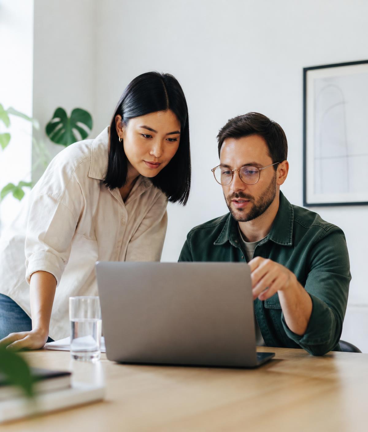 Two colleagues reviewing agent conversations